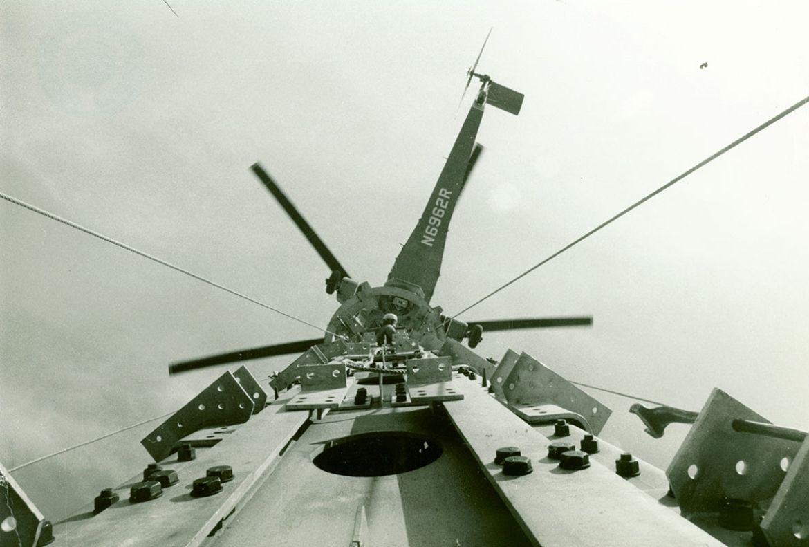 A photo taken from the outside of the Tower shows the helicopter, named Olga, hovering above the Tower in March 1975.